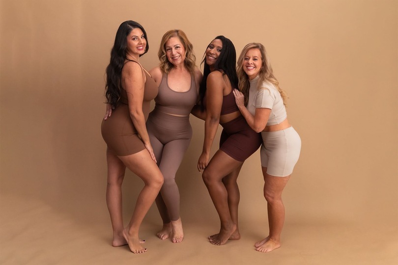 Patient ambassadors posing after fat removal laser liposuction