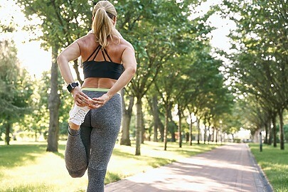 Female stretching and warming up for outdoor run