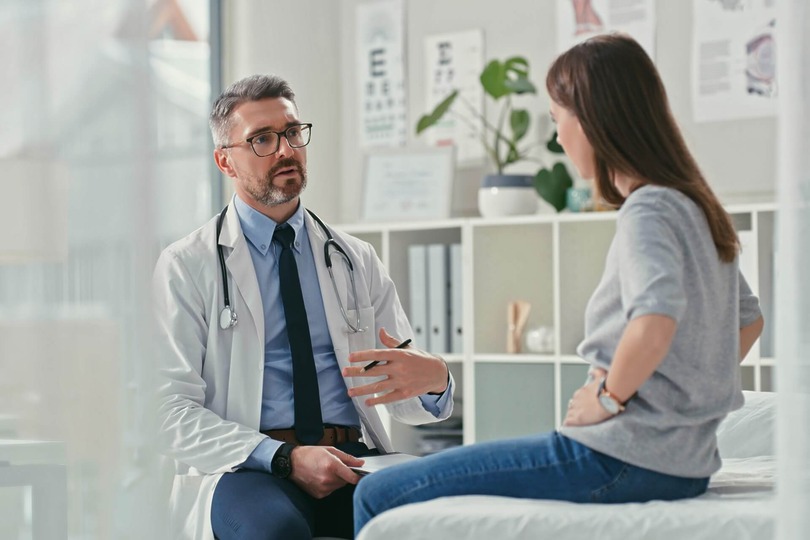 Surgeon answering patient questions during consultation