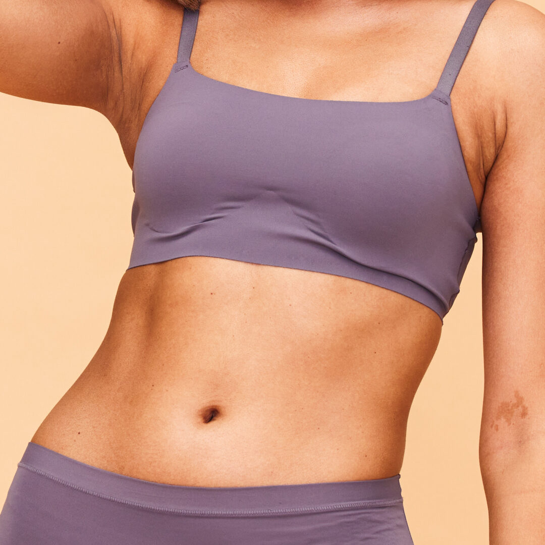 Healthy body, dance and happy woman in lingerie in studio