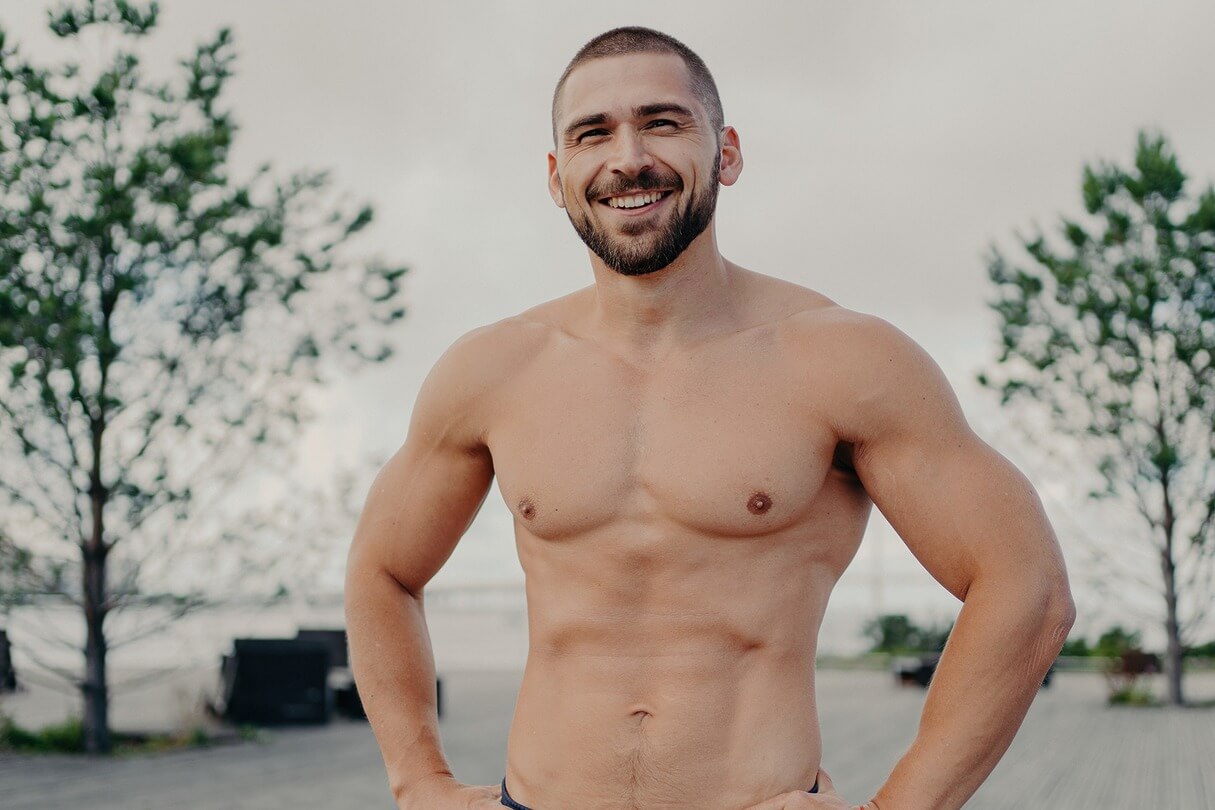 Man poses shirtless after laser liposuction