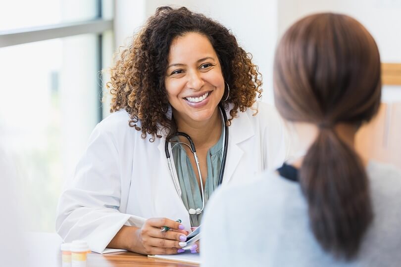 Physician discussing procedure benefits with patient