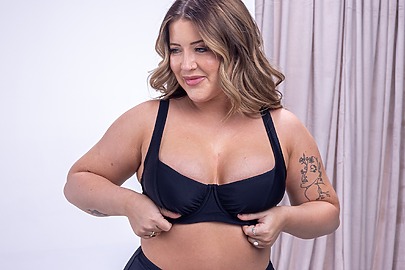 Female in bra after breast augmentation