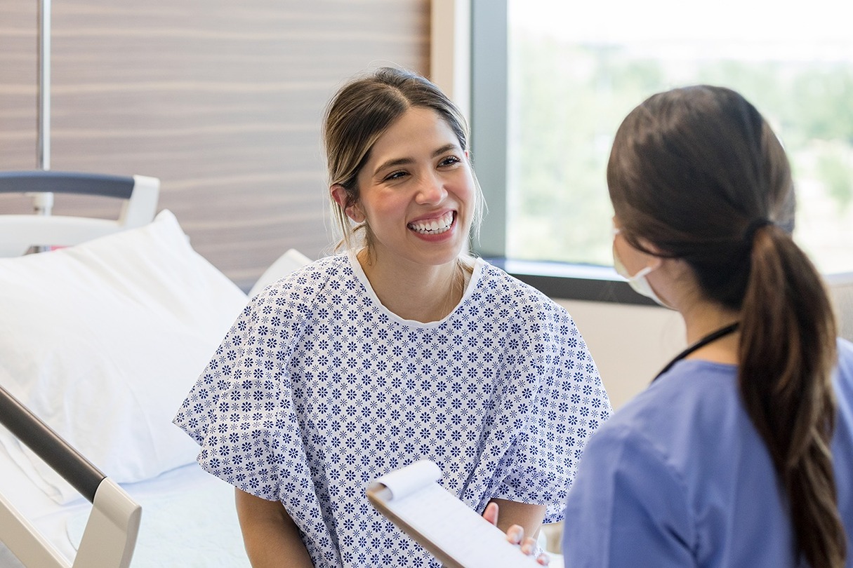 Patient discussing procedures with Sono Bello surgeon