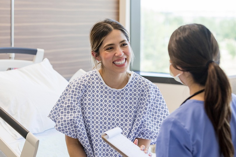 Patient discussing procedures with Sono Bello surgeon