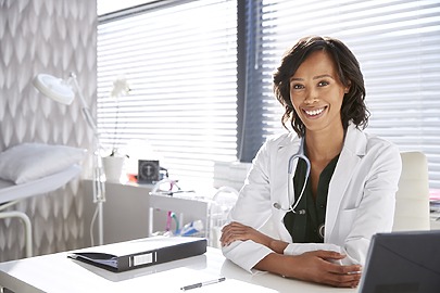 Surgeon at desk in medical office