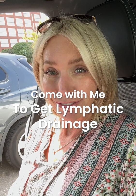 Woman in patterned top sitting in a car, with text overlay: "Come with Me to Get Lymphatic Drainage".